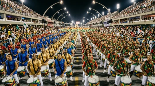 Massive bateria percussion section performing at Rio Sambadrome with hundreds of drummers creating powerful rhythmic wall of sound