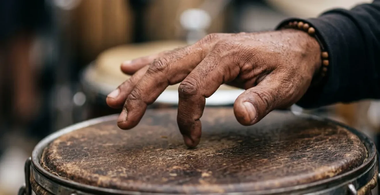 Extreme close-up of percussionist hands executing the virado flip technique on drum surface