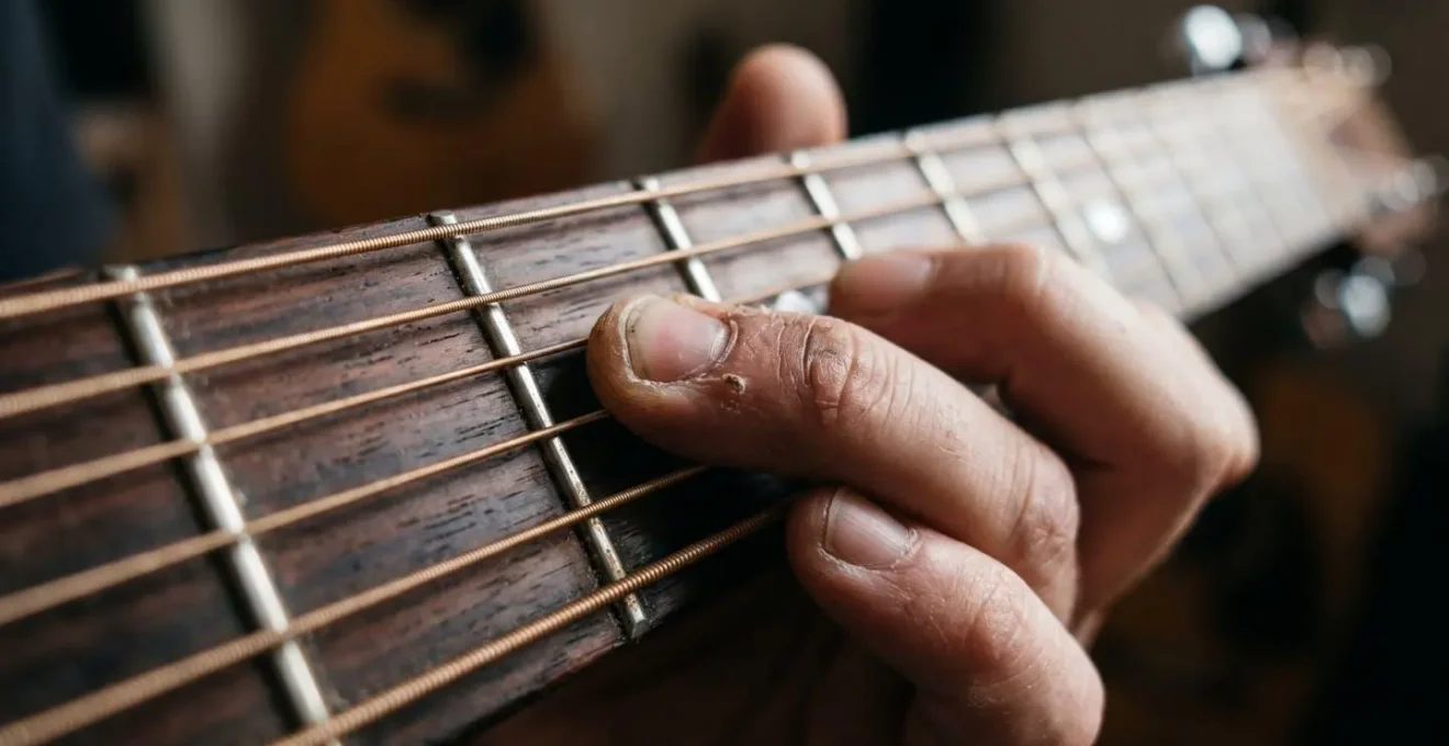 Close-up of musician's hands on guitar fretboard with subtle rhythmic motion blur suggesting varied accent patterns